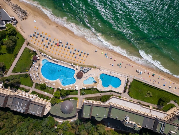 Aerial top view of Bulgaria's Golden Sands resort during the summer season an array of hotels pools and crowds of people enjoying the sea