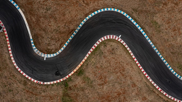 Aerial top view motorsport race asphalt track circuit motor racing track Race track curve Curving race track view from above Aerial view car race asphalt track and curve