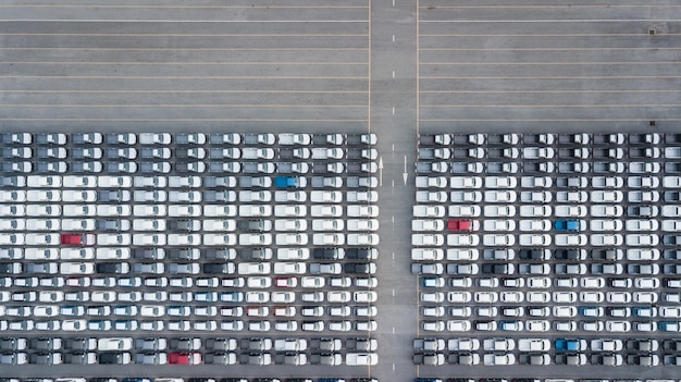 Aerial top view new cars lined up in the port for import export business