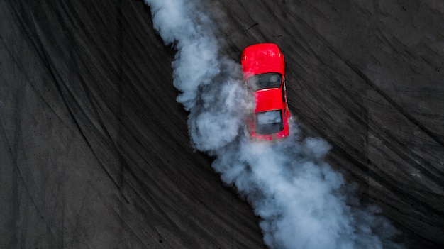 Aerial top view professional driver drift car on asphalt track with smoke, View from above car drift.