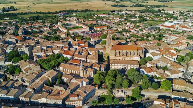 Aerial top view of residential area houses roofs and streets from above, old medieval town background, France