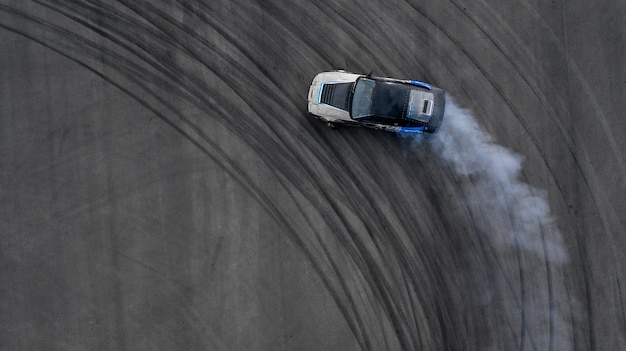 Aerial top view two car battle drifting car