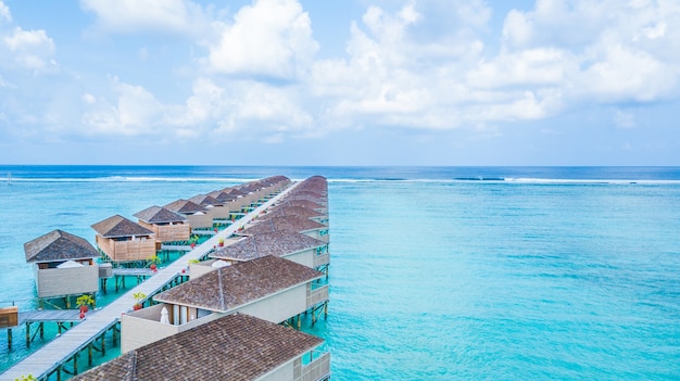 Aerial top view water villa at Maldives island