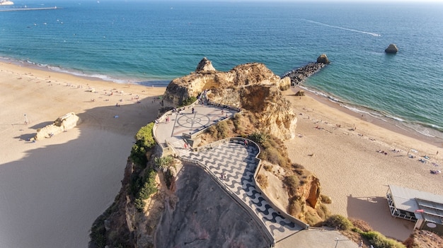 Aerial. Traditional Portuguese paving stones, on beach Portimao