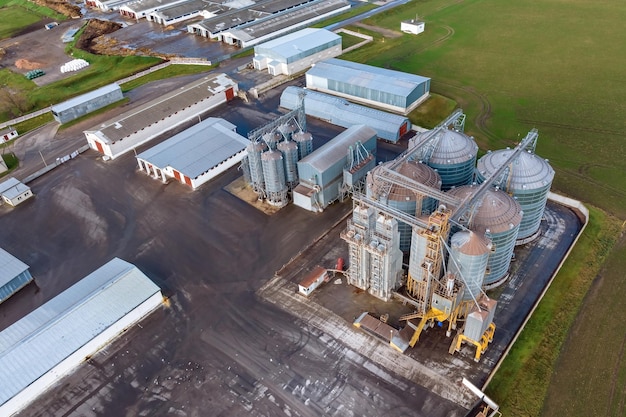 Aerial view on agroindustrial complex with silos and grain drying line