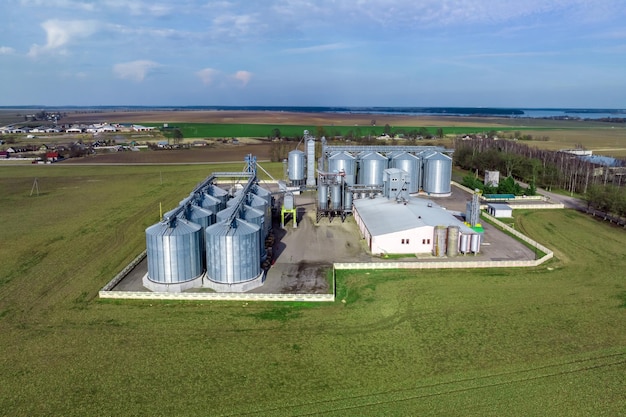 Aerial view of agroindustrial complex with silos and grain drying line