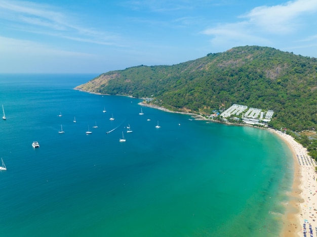 Aerial View Amazing beach with travel people relaxation on the beachBeautiful sea in summer season at Phuket island ThailandTravel people on beachBeach during summer with many resting people