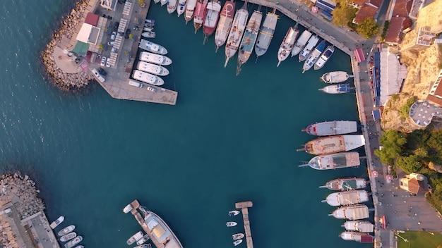 Aerial view of amazing boats Marina bay Top view from drone of harbor with yacht motorboat and sailboat Seascape