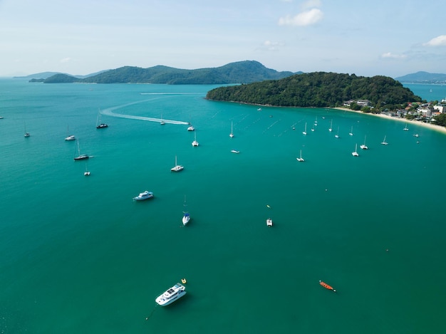 Aerial View Amazing sea with travel boatssailing boats in the seaBeautiful sea in summer season at Phuket island Thailand Travel boatsOcean during summer