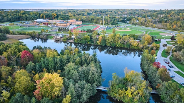 Aerial View of Autumn Park with Pond and Sports Facilities Michigan