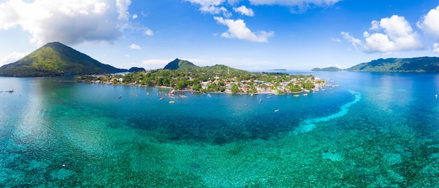 Aerial view Banda Islands Moluccas archipelago Indonesia, Pulau Gunung Api, lava flows, coral reef white sand beach. Top travel tourist destination, best diving snorkeling.