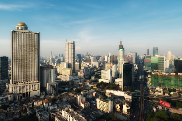 Aerial view of Bangkok modern office buildings in downtown with sunset sky , Bangkok , Thailand.