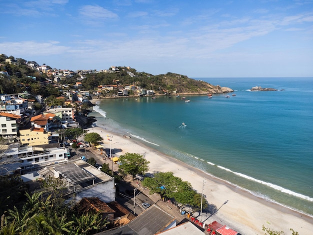 Aerial view of Barra de Guaratiba west zone of Rio de Janeiro Brazil Next to Marambaia beach Big hills around Sunny day at dawn Beach with clear water Barra de Guaratiba beach Drone photo