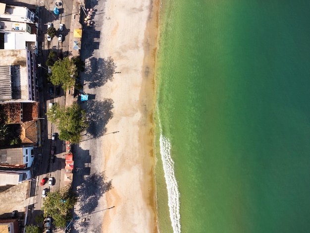 Aerial view of Barra de Guaratiba west zone of Rio de Janeiro Brazil Next to Marambaia beach Big hills around Sunny day at dawn Beach with clear water Barra de Guaratiba beach Drone photo