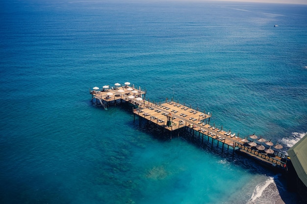 Aerial view of the beach and the mediterranean sea beautiful clear sea water on a warm sunny day The concept of rest in a warm country