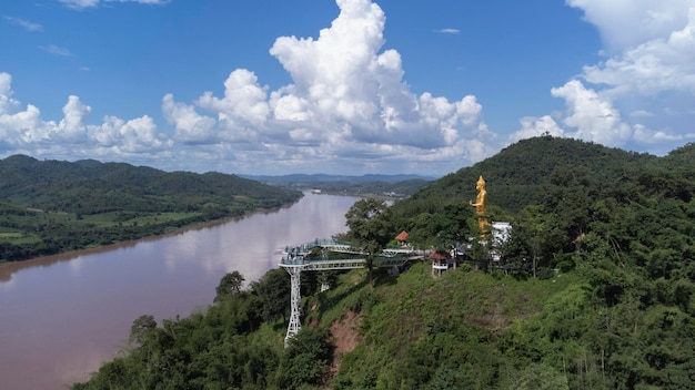 Aerial view of beautiful bridge or glass sky walk is new landmark viewpoint bettween Thailand and Laos PDR at Phra Yai Phu Khok Ngio Chiang Khan Loei Province Mekong river Thailand