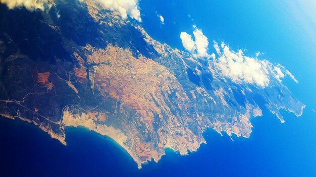 Aerial view to the beautiful Cyprus island in the blue sea with clouds Travel vacational seasonal summer background