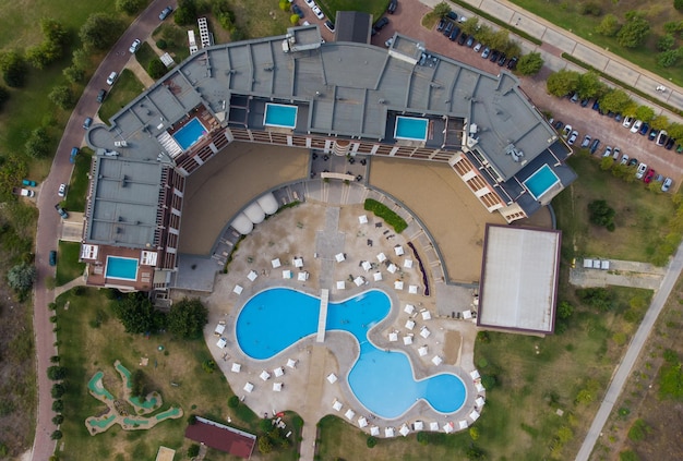 Aerial view of beautiful luxury outdoor swimming pool in hotel resort