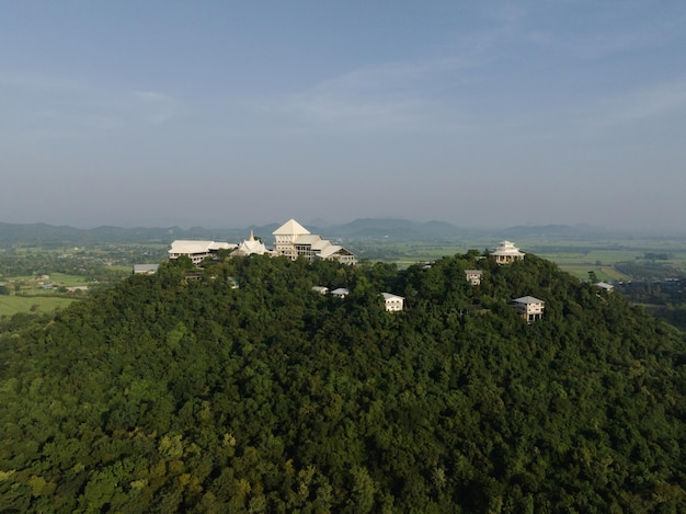 An aerial view of Beautiful Temple on the mountain stands prominently at Wat Nong Hoi in Ratchaburi near the Bangkok Thailand