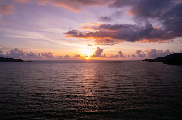 Aerial view Beautiful view sunset over sea surface beautiful wave Amazing light sunset or sunrise sky over sea beach with wave crashing in the oceannature background