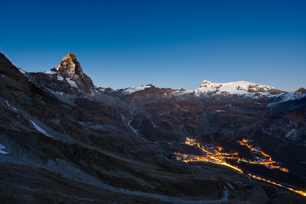 Aerial view of Breuil Cervinia village glowing in the night