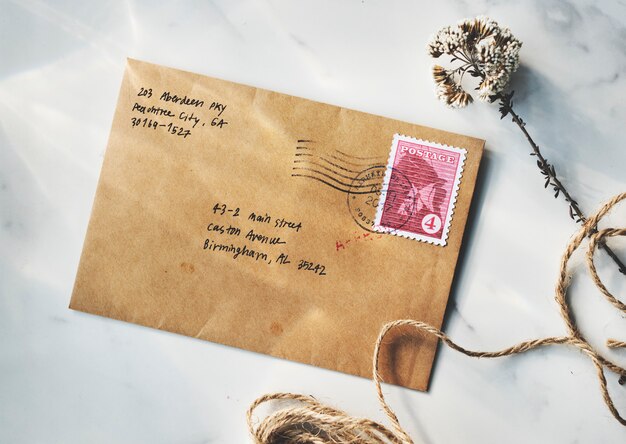 Aerial view of brown envelope on marble table