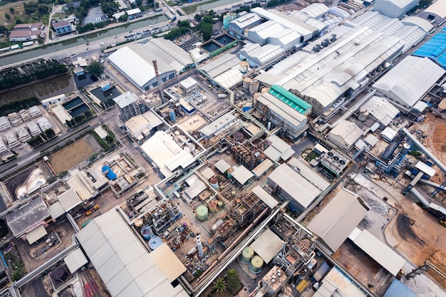 Aerial view of building infrastucture of industry power plant smart chamical gas and oil refinery pipeline warehouse in safety zone