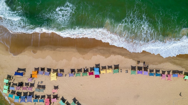 Aerial view of Caraiva beach Porto Seguro Bahia Brazil Colorful beach tents sea and river