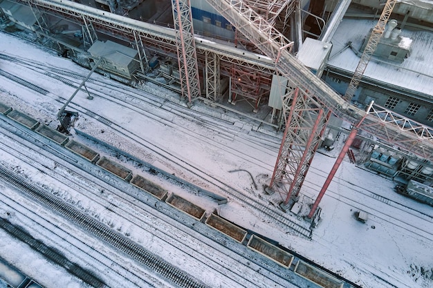 Aerial view of cargo train cars loaded with construction goods at mining factory Railway transportation of industrial production raw materials