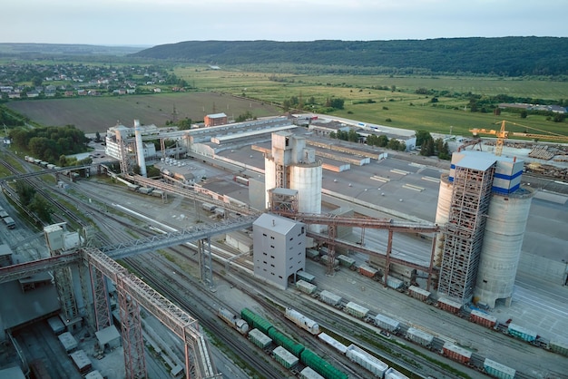 Aerial view of cargo train cars loaded with construction goods at mining factory Railway transportation of industrial production raw materials