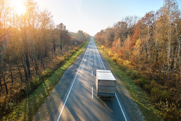 Aerial view of cargo truck driving on highway hauling goods Delivery transportation and logistics concept