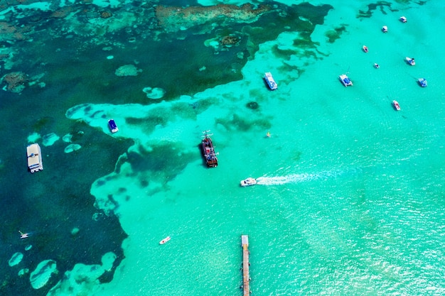 Aerial view of caribbean resort with bridge and boats