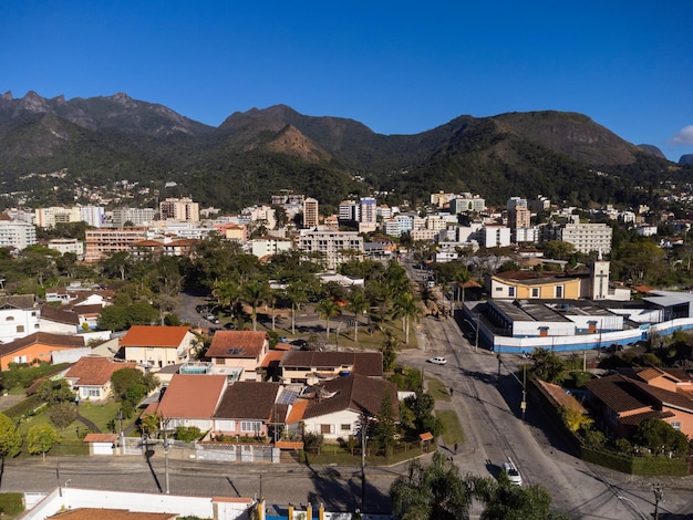 Aerial view of the city of Teresopolis Mountains and hills with blue sky and many houses in the mountain region of Rio de Janeiro Brazil Drone photo Araras Teresopolis Sunny day Sunrise