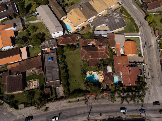 Aerial view of the city of Teresopolis Mountains and hills with blue sky and many houses in the mountain region of Rio de Janeiro Brazil Drone photo Araras Teresopolis Sunny day Sunrise