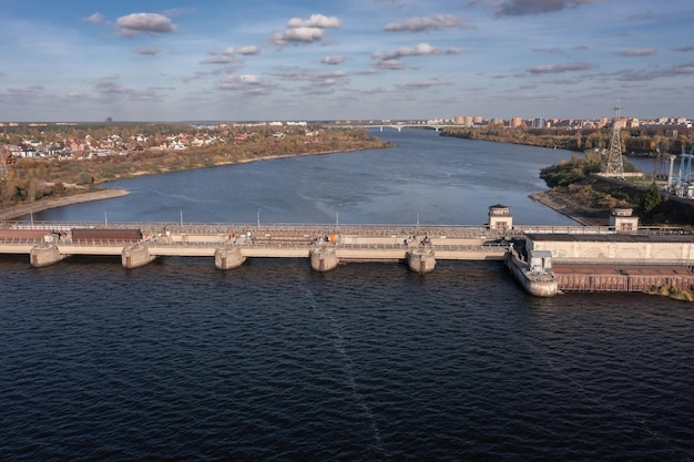 Aerial view of city on Volga river with dam and waterpower plant in foreground Dubna Russia