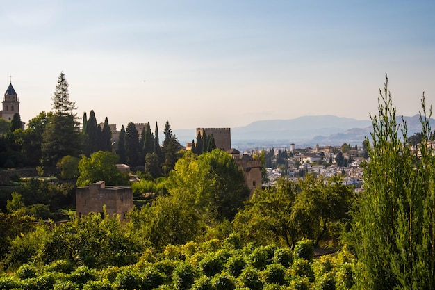 Aerial view of the city with historic center of Granada with some part of Alcazaba castle and Sierra Nevada on background