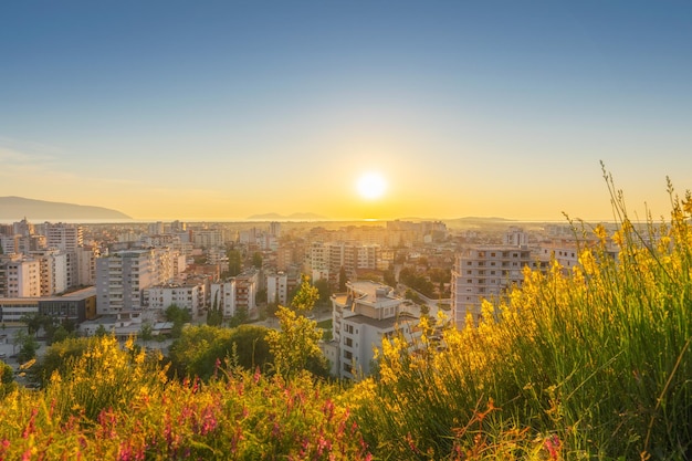 Aerial view of the cityscape and tiled roofs of the old city of vlore at sunset albania