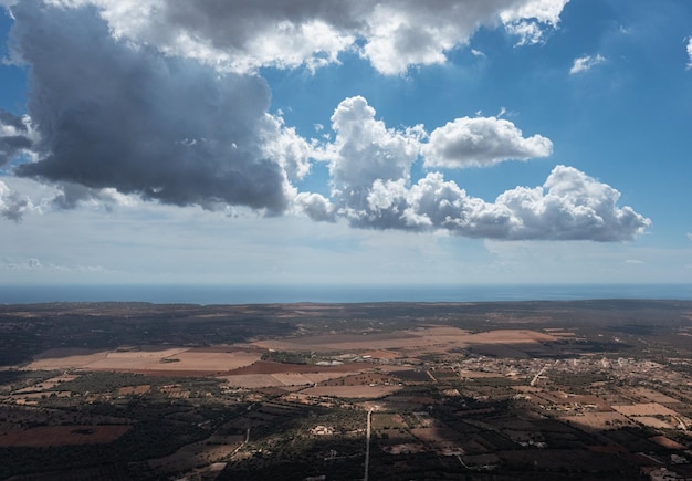 Aerial view of the clouds casting shadows over the country with the Mediterranean Sea on the back