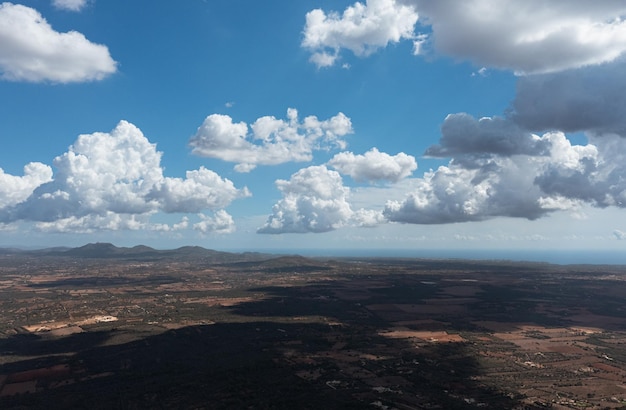 Aerial view of the clouds casting shadows over the country with the Mediterranean Sea on the back