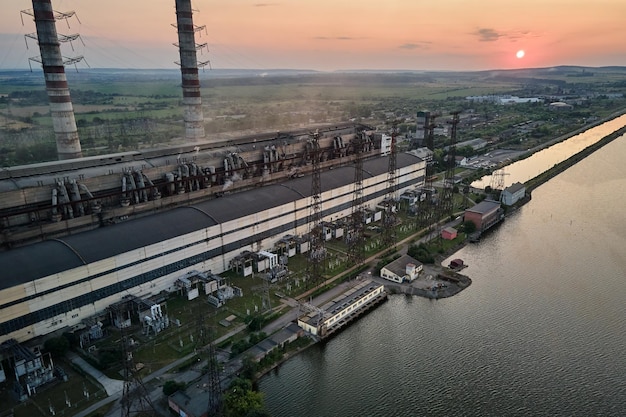 Aerial view of coal power plant high pipes with black smokestack polluting atmosphere Electricity production with fossil fuel concept