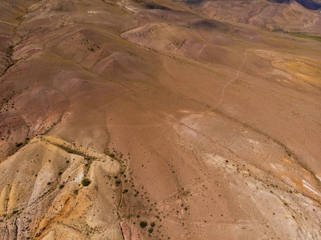 Aerial view of colorful eroded landform of Altai mountains in popular tourist location called Mars, Chagan-Uzun, Altai Republic, Russia