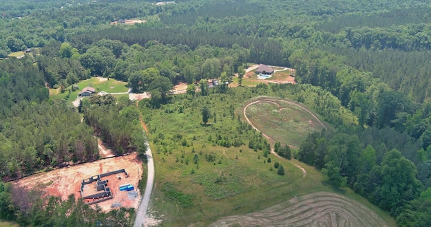 Aerial view of construction area building a house in the middle of the forest