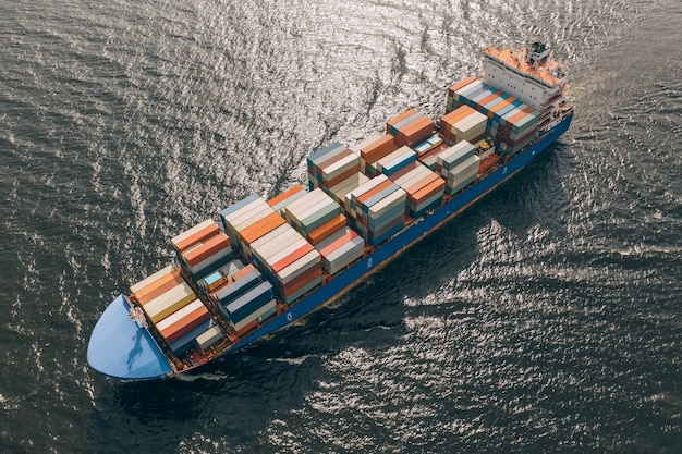 Aerial view of container ship floating in sea