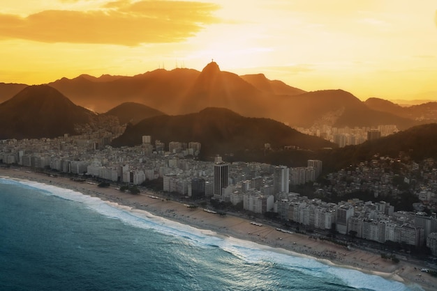 Aerial view of Copacabana at sunset with Corcovado Mountain Rio de Janeiro Brazil