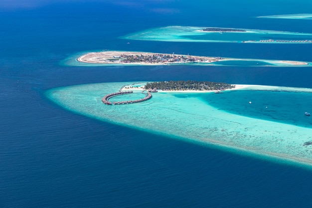 Aerial view of coral reefs in Maldives islands Tropical aerial landscape Luxury summer vacation