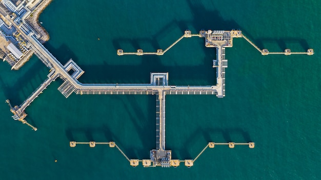 Aerial view crude oil terminal, Loading arm oil and gas refinery at commercial port.