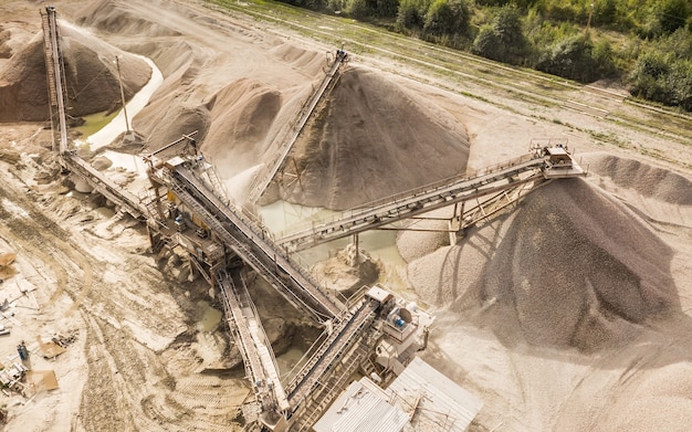 Aerial view of crushed stone quarry and belt conveyors