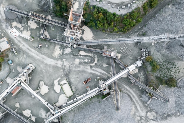 Aerial view of crushing equipment stone crusher in a quarry mining equipment for processing and sorting stone crushed stone flour