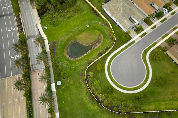 Aerial view of culdesac at neighborhood street dead end with tightly packed homes in Florida closed living clubs Family houses as example of real estate development in american suburbs