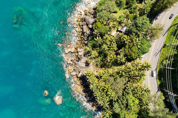 Aerial view of curve road along the seashore at Phuket Thailand beautiful seacoast and open sea in summer season Nature recovered Environment and Travel background